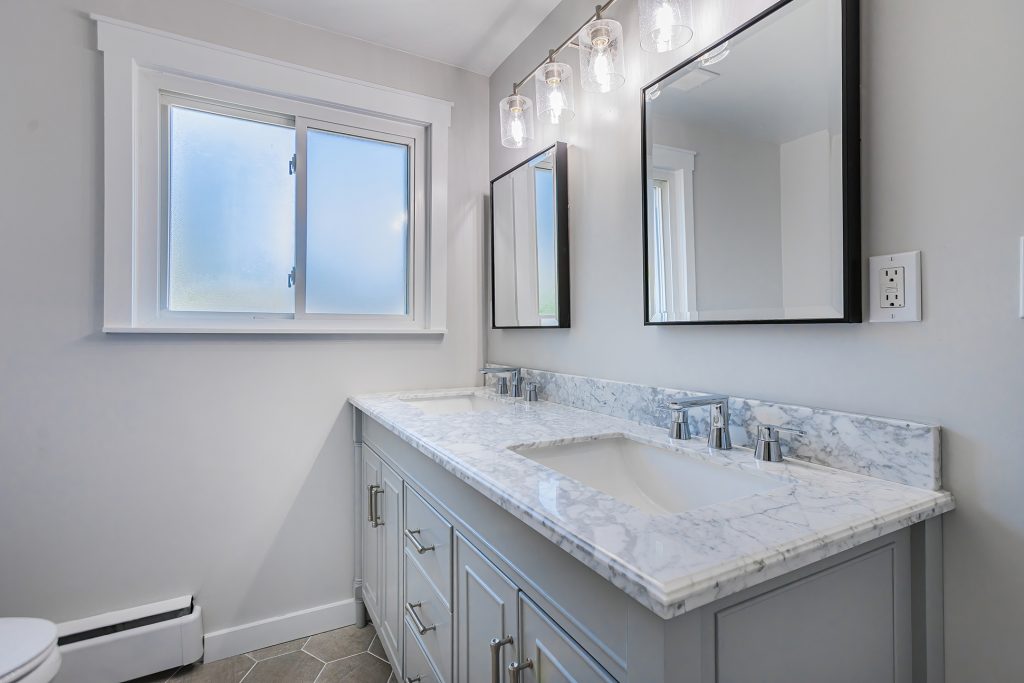 White Marble with Mirrors Luxury Bathroom Remodeling Project by LHS Remodeling & Design